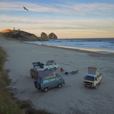 there are many cars parked on the beach