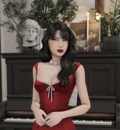 a woman in a red dress standing next to a piano