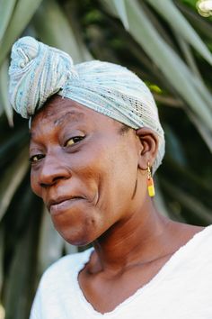 an older woman with a turban on her head