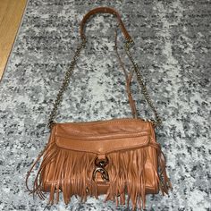 Brand New Never Worn Leather Excellent Condition With Chain Straps And Gold Clasp Also Gold Hardware Leather Fringes Trendy Leather Clutch, Trendy Leather Clutch With Gold-tone Hardware, Chic Tan Shoulder Bag With Chain Strap, Leather Clutch With Chain Strap For Shopping, Brown Leather Clutch With Chain Strap, Brown Clutch With Chain Strap For Travel, Leather Clutch With Chain Strap For Travel, Rebecca Minkoff Bag, Leather Fringe