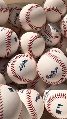 many baseballs are piled up together in a pile with the words los angeles angels on them