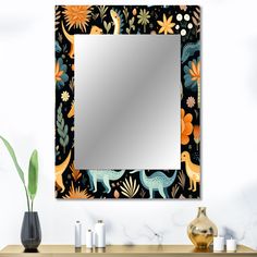 a mirror that is sitting on top of a table next to a vase with flowers