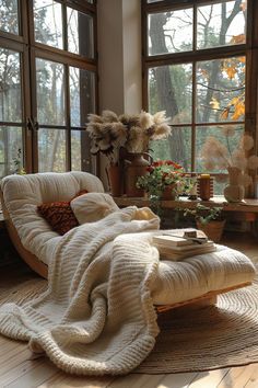 a living room filled with lots of windows and furniture