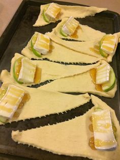 several pieces of food are arranged on a baking sheet