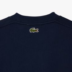 Lacoste Signature Print Cotton T-shirt Navy Blue TH2733 166 A Lacoste wardrobe essential, designed to move with you. This heavy jersey T-shirt features iconic branding and pleat details. A warm, comfortable design with an impeccable finish. A versatile piece made for modern life.This unisex product runs large, if you are a woman, choose 1 size smaller than your usual size. Heavy cotton jersey Comfortable cut, dropped shoulders Timeless crew neck Contrast print on breast Embroidered crocodile on Paris T Shirt, Comfortable Design, Signature Print, Modern Life, Product Label, Jersey T Shirt, Wardrobe Essentials, Cotton T Shirt, Heavy Cotton