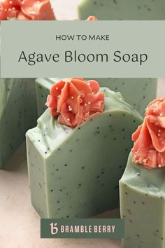 four pieces of green soap with orange flowers on them sitting on a white counter top