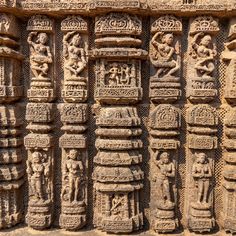 an intricately carved wall with carvings on it