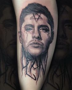 a man's face with lines and stars on his head is shown in this artistic tattoo