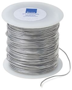 a spool of silver colored wire on a white background with a cord attached to it