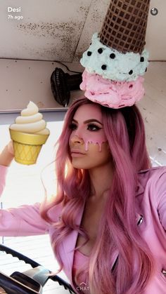 a woman with pink hair wearing an ice cream cone hat