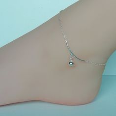 Sterling silver anklet with an arc and a ball. Length: 9 -10.50 inches. Arc: 30mm Ball: 6 mm Price listed is for ONE piece. These anklets are made of 925 hypoallergenic sterling silver. All my pieces are sent in a gift box. I can include a personal message from you if needed. You are welcome to contact me at... bhavnakwintra1956@gmail.com More anklets https://www.etsy.com/shop/TheSilverGame?ref=seller-platform-mcnav&section_id=26713873 More hoops: https://www.etsy.com/your/shops/TheSilverGam Silver Minimalist Metal Anklets, Minimalist Silver Metal Anklets, Minimalist Sterling Silver Anklets In Silver, Unique Anklets, Silver Chain Anklet, Anklets Indian, Foot Chain, Wanderlust Jewelry, Charm Anklet