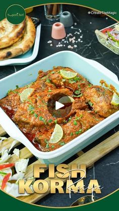 fish korma in a white dish on a wooden cutting board