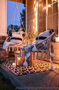 the porch is decorated with lights and hammock style chairs for relaxing in the evening