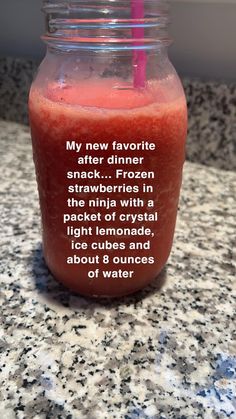 a drink in a mason jar with a pink straw