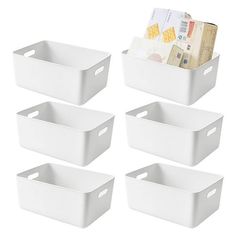 six white storage bins with money in them