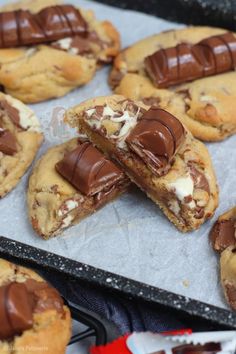 chocolate chip cookies are arranged on a baking sheet