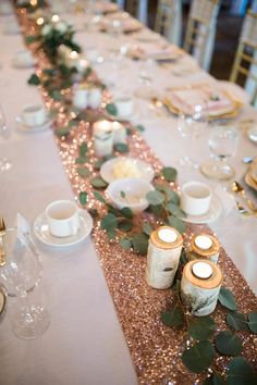 the table is set with candles and place settings