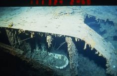 the bottom part of an old ship that is under water