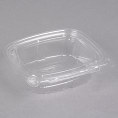 a plastic container with no lid on a gray surface