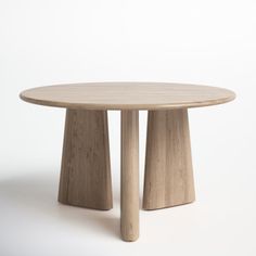 a round wooden table with two legs on the top and one leg raised up to the ground