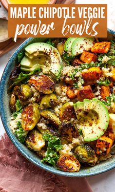 a bowl filled with roasted vegetables and topped with feta cheese, avocado