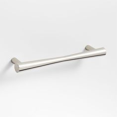 a metal handle on a white wall