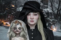 a woman dressed in black holding a doll