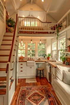 a living room filled with furniture and lots of windows