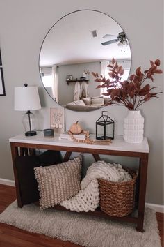 a mirror sitting on top of a wooden table