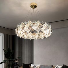 a chandelier hanging from the ceiling in a living room