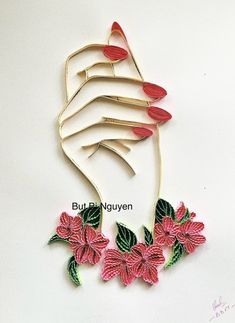 a hand with red flowers and green leaves on it is made out of metal wire