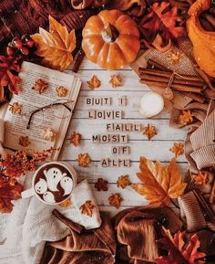 an autumn scene with pumpkins, leaves and books