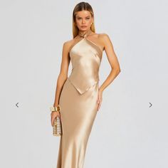 Step Into A Realm Of Elegant Style With Our Ethereal Ester Dress. This Halterneck Top Features Two Tie Elements At Its Back And A Mermaid Silhouette Skirt. Nude/Gold 76% Acetate, 24% Polyester *** I Had This Dress Hemmed In Nyc - Had The Length Shortened - I Am 5’3 3/4 And Fits Perfectly In Heals. I Also Had Them Hem The Top So It’s Straight Across - Makes The Dress Lay Better/Smoother. Wore One Time To My Cousins Wedding (In Wedding Party - Her Color Is Gold) And Dry Cleaned So Like New! Ethereal Casual Outfit, Elegant Gold Dress, Gold And White Dress, Gold Silk Dress, Ethereal Dress, Halterneck Top, Halter Neck Top, Mermaid Silhouette, Gold Silk