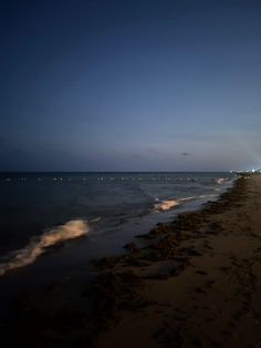 the beach is empty at night time with no people on it or in the water