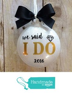 a glass ornament with the words we said i do on it