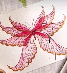 a drawing of a pink butterfly on white paper