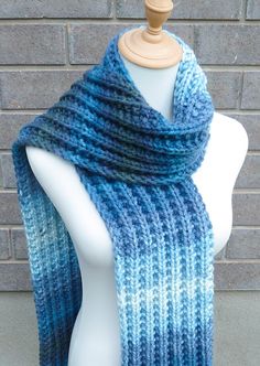 "This beautiful hand knitted scarf is made with Soft  100% Acrylic Yarn. Classic ribbed pattern. The scarf can be worn in multiple ways. Very beautiful colors: shades of blue, teal, and grey green. The colors may appear slightly different on different monitors. Measures: 67\" (170 cm) long x 6.5\" (17 cm) wide. From a smoke-free home. Care instructions: Hand wash in cool water and dry flat." Blue Yarn Knitting Pattern For Winter, Winter Blue Yarn Knitting Pattern, Winter Knitting Pattern In Blue Yarn, Blue Knitted Yarn Scarves, Blue Knitted Yarn Scarf, Blue Crochet Scarves For Winter, Blue Knitted Scarf, One Size, Blue Knitted Scarf One Size, Blue Knitted Scarves One Size