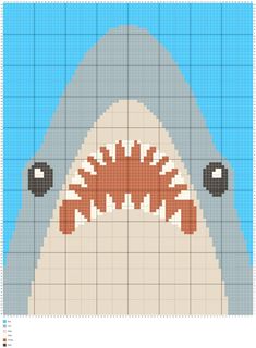 a cross stitch pattern with a shark's head in the center and teeth on it