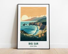 a poster with the words big sur on it in front of a white wall and wooden floor