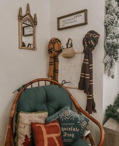 a chair that has some pillows on it in front of a wall with pictures and decorations