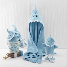 a stuffed shark and its baby in a bathrobe