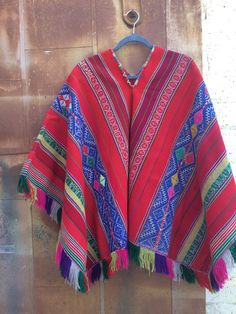 Vintage Handloomed Boho Multi Colored Poncho Traditional Red One-size Poncho, Traditional Red Shawl Poncho, Red Bohemian Poncho Cape, Red Bohemian Cape Poncho, Traditional Multicolor Cape Poncho, Traditional Red Poncho For Festivals, Red Cape Poncho For Festival, Artisan Handwoven Multicolor Poncho, Traditional Multicolor Cape For Fall