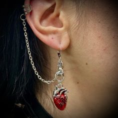 These vampire gothic earrings are the perfect accessory to style your dark side! One earring includes an anatomical heart with a chain that links to your ear. another earring represents a blood drop! Vampire Jewelry Earrings, Vampiric Jewelry, Vampire Ears, Vampire Accessories, Vampire Earrings, Vampire Jewelry, Vampire Gothic, Blood Drop, One Earring