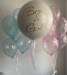 a bunch of balloons that say boy or girl