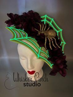 This one-of-a-kind Halloween headband will be sure to add a glamorous touch to any party ensemble! ❤️ Make a statement at your Halloween gatherings!  Add a fun, green spider web fascinator to your outfit.  This headpiece is a great way to stand out from the crowd, turn heads and get tons of compliments!   Glow in the dark paint adds an unexpected twist and the purple floral accents with a glittered, gold spider bring a touch of glamour and flair. This design looks fantastic from the front and ba Halloween Headpiece, Halloween Crown, Green Spider, Glow In The Dark Paint, Halloween Unique, Dark Paint, Halloween Headband, Halloween Spider Web, Halloween Spider