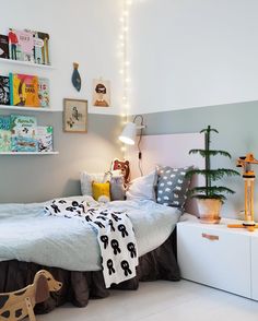 a child's bedroom decorated in gray and white