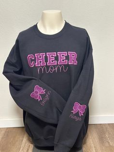 Beautiful glitter appliqué CHEER MOM crewneck or hoodie . Customized to fit your team colors. Up to 2 names can be added any extra names will have an extra fee.  Specify colors and names on the personalization section.  Additional sweater colors may be available to order but there will be a longer production time.  Any extras message me for more info or email at lopescustomdesigns@gmail.com Sweater Colors, Mom Crewneck, Mom Sweater, Cheer Mom, Mom Sweatshirt, Personalized Embroidered, Fleece Sweatshirt, Gmail Com, Team Colors