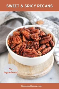 a bowl filled with pecans sitting on top of a table