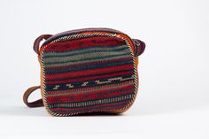 "Handwoven Kilim Bag / Boho Handbag / Vintage Bohemian Carpet Purse The bag is made from vintage wool kilims and has two faces. Each side has different patterns. Inside of the handles are made out of leather. Inner bag is completely covered with fabric and includes a zippered pocket. --Attention: This particular item has defective. Inside pocket's zipper doesn't work unfortunately. -- The measurements are 7,8\" x 8,6\" x 2,7\" (20 cm x 22 cm x 7 cm) Also you can check other bags with this link b Traditional Multicolor Shoulder Bag With Removable Pouch, Traditional Multicolor Rectangular Bag, Multicolor Rectangular Hobo Bag Gift, Multicolor Square Box Bag For Mobile Phone, Traditional Multicolor Bag With Adjustable Strap, Multicolor Rectangular Travel Pouch, Bohemian Rectangular Pouch For Daily Use, Red Woven Rectangular Shoulder Bag, Traditional Multicolor Bag With Removable Pouch