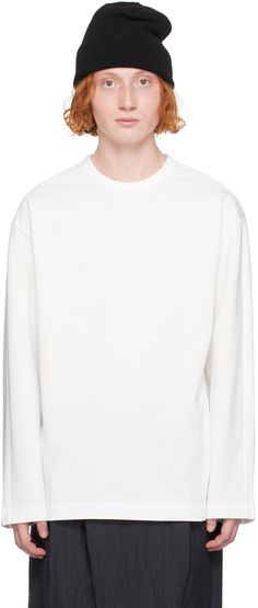 Loose-fit cotton jersey T-shirt. · Rib knit crewneck · Logo embroidered at chest · Logo hardware at side seam Supplier color: White Crew Neck Cotton T-shirt With Ribbed Cuffs, Classic Cotton T-shirt, Classic Oversized Crew Top, White T-shirt With Ribbed Neckline And Relaxed Fit, Fall Crew Neck T-shirt With Ribbed Neckline, Fall T-shirt With Ribbed Crew Neck, Basic Crew Neck Top With Double-needle Sleeve, Oversized Crew Neck Top, Long Sleeve T-shirt With Ribbed Neckline And Relaxed Fit